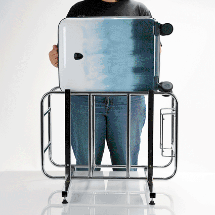 Tie-Dye Blue 21" Spinner™ Carry-On Luggage putting in a cage | Fashion Luggage
